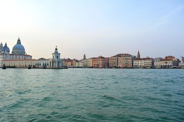 italy venice lagoon cityscape from boat at sunset