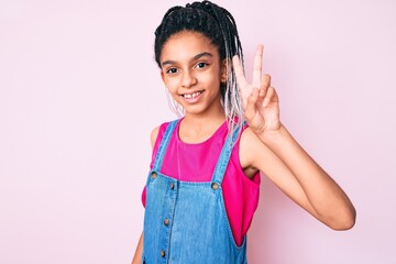 Young african american girl child with braids wearing casual clothes over pink background showing and pointing up with fingers number two while smiling confident and happy.