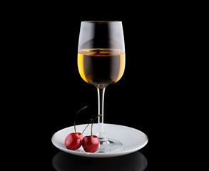 white wine in a glass glass on a saucer, next to three cherries, still life, winemaking.