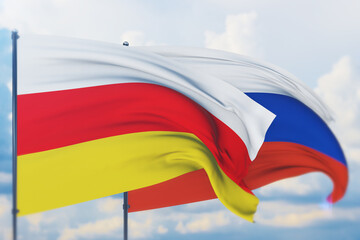 Waving Russian flag and flag of South Ossetia. Closeup view, 3D illustration.
