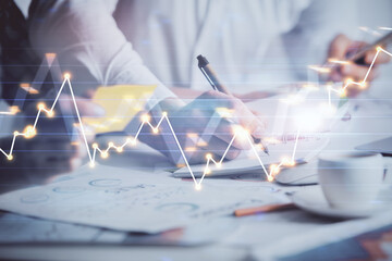 Double exposure of forex graph drawing over people taking notes background. Concept of financial analysis