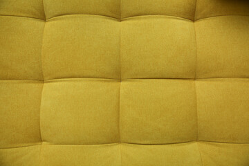 yellow fabric sofa upholstery with stitching