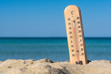 Mercury thermometer on the beach, close up