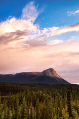 Canadian Mountain Landscape View during dramatic Sunset. Taken in Yukon, Canada. Nature Background