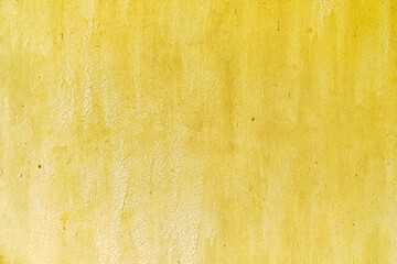 Plywood wall texture with old cracked yellow paint