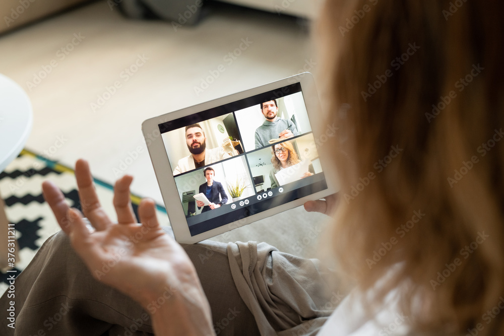 Poster tablet with participants of online conference on display during communication