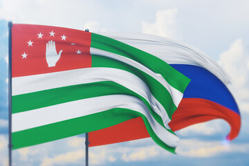 Waving Russian flag and flag of Abkhazia. Closeup view, 3D illustration.