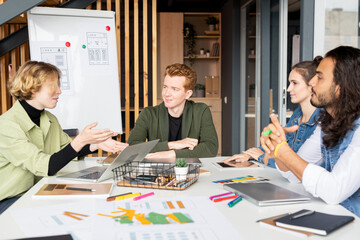 Young contemporary creative developers of mobile applications brainstorming