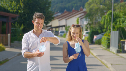 PORTRAIT: Boyfriend and girlfriend are relieved to take off their surgical masks