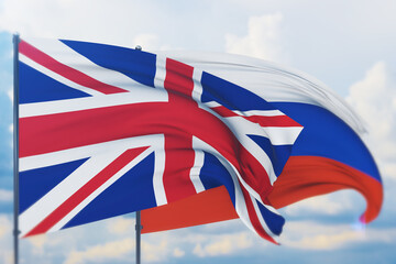 Waving Russian flag and flag of UK. Closeup view, 3D illustration.