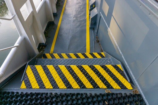 Safety Walkway On Ships Deck. Yellow Line Walkway. Guided Walkway On Board. Passenger / Contractor Footpath On Board Offshore Vessel.