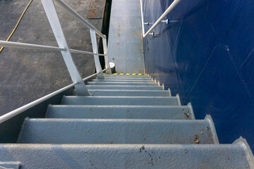 Ships stairs / stairway.  First step off stairway painted in yellow black. Ships anti-slip stairs.