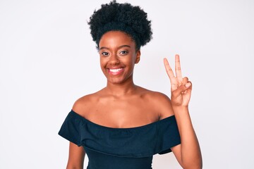 Young african american woman wearing casual clothes showing and pointing up with fingers number two while smiling confident and happy.