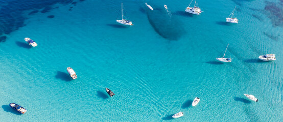 View from above, stunning aerial view of a bay with boats and luxury yachts sailing on a turquoise,...