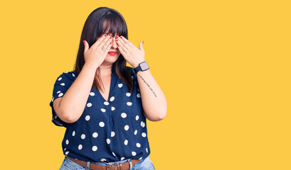 Young plus size woman wearing casual clothes rubbing eyes for fatigue and headache, sleepy and tired expression. vision problem