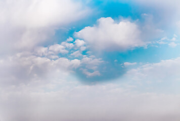 fluffy clouds in the blue sky