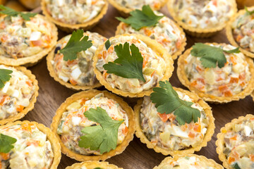 Salad with herbs in tartlets