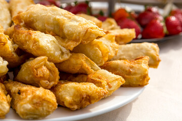 Fresh pastries are on a white plate