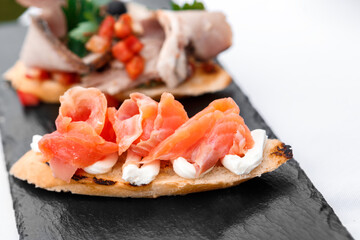 Cooked red fish sandwiches on a tray