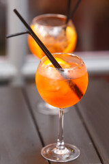 Cocktail glass with a slice of ripe orange