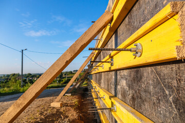 Close-up construction of a retaining wall or counterfort, formwork, reinforced, preparation to pour concrete, construction site. Improvement of the territory. Preventive measures against landslide