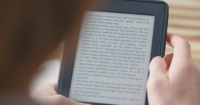 Woman reading an ebook on a reader with an e-ink display.