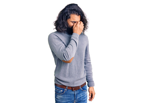 Young arab man wearing casual clothes tired rubbing nose and eyes feeling fatigue and headache. stress and frustration concept.