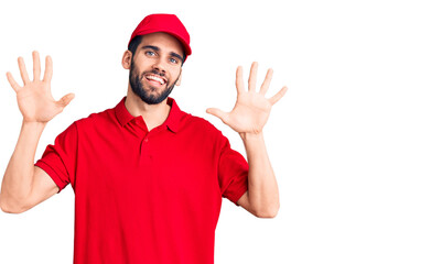 Fototapeta na wymiar Young handsome man with beard wearing delivery uniform showing and pointing up with fingers number ten while smiling confident and happy.