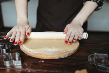 confectioner rolling gingerbread dough