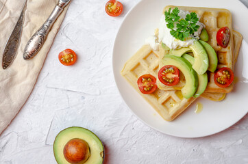 Vegan waffles with avocado with yogurt and cherry