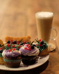 Cakes on a plate and latte, good breakfast