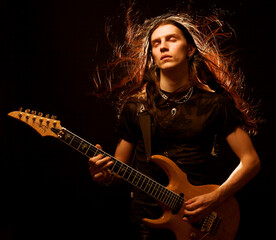 man playing electrical guitar