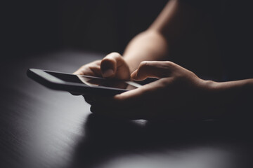 Close up shot of hands holding smart phone, using typing message for searching on smart phone.