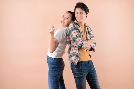 Young Attractive Asian Couple Fun And Energy Playful Photoshoot In Studio Isolate Color Background