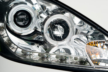 Obraz premium Close up of luxury car lighting lamp on white car.