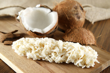 Cocada, coconut candy. Composition on wooden background.