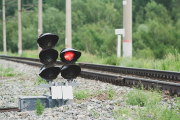 traffic light on railroad tracks close-up. movement of trains and freight trains. Railway