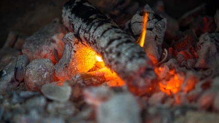 Background of hot wood charcoal and firewood.