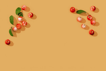 Pattern from small red apples and green leaves, autumn harvest concept.