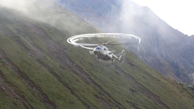 Fog around Indian air force helicopter propeller while landing in height of 3,553 meters in Himalayas .