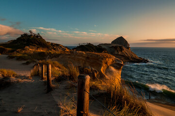 Beautiful sunset shining on red rocks of Cape Kiwanda