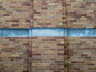 brick wall background with jut out and cement strip