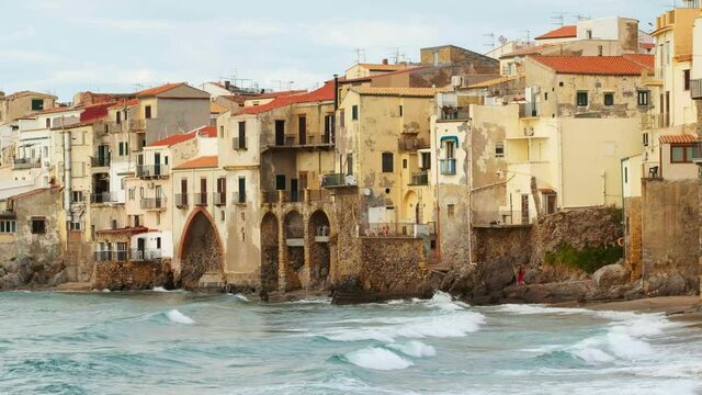 Historic buildings in Cefalu Old town at sunset