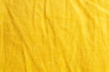 Yellow crumpled fabric texture. Color textile background.