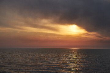 Sea sunset. Smoke wildfires sweeping across the sky.
