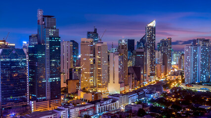 Early evening shot of Makati skyline, Metro Manila, Philippines. - obrazy, fototapety, plakaty