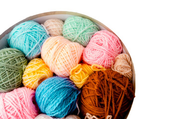 Colorful Balls of wool with knitting needles on white background,hobby and free time concept. Yarns for knitting copyspace