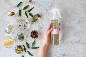 Woman with natural homemade air freshener at table