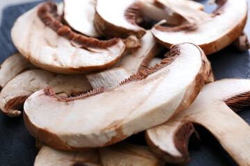 Cut raw mushrooms on table, closeup