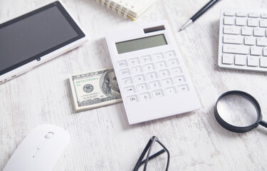 Hundred dollar banknotes with business objects.